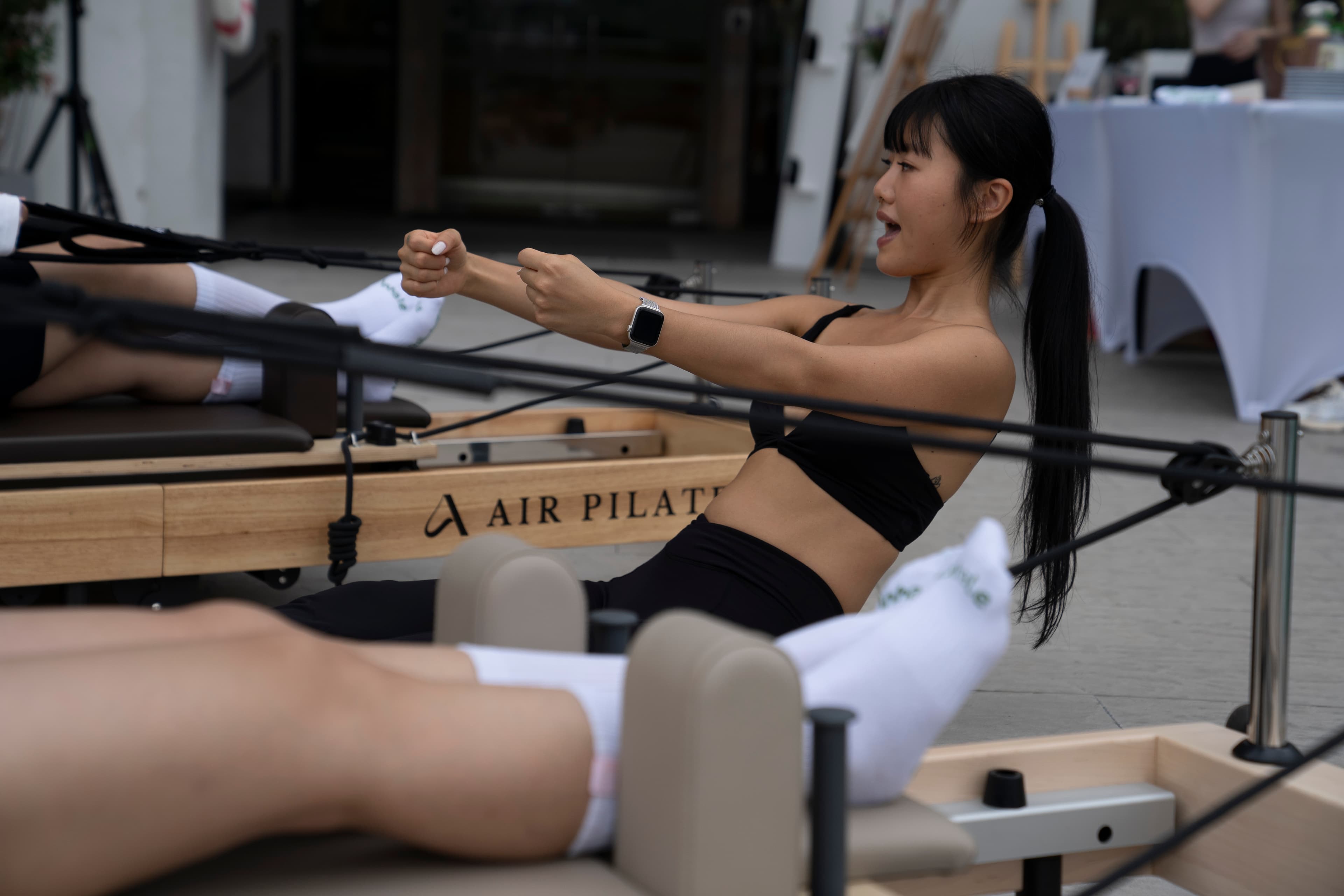 Participants laughing during a Jinere reformer class