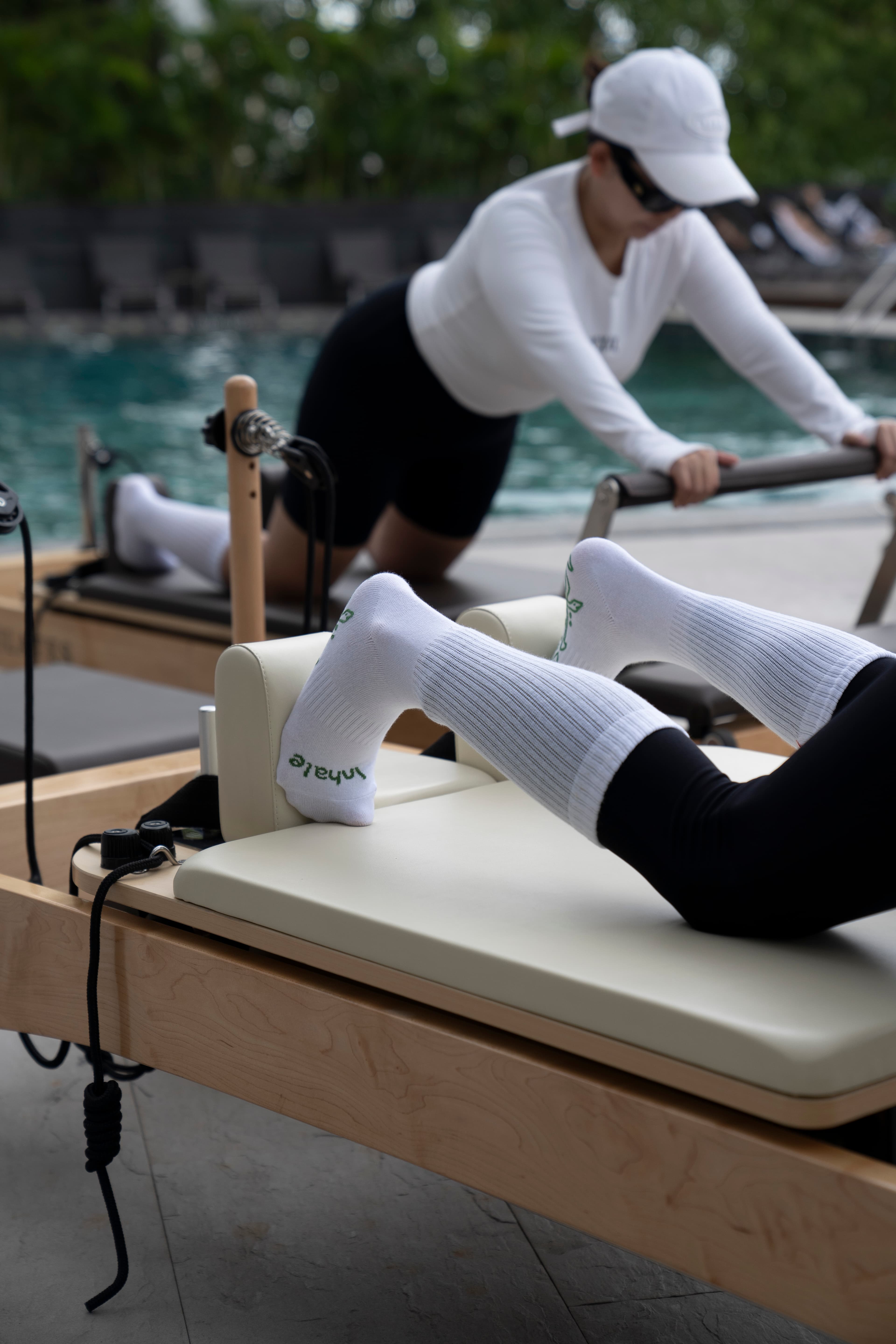 Instructor assisting a participant at a Jinere event